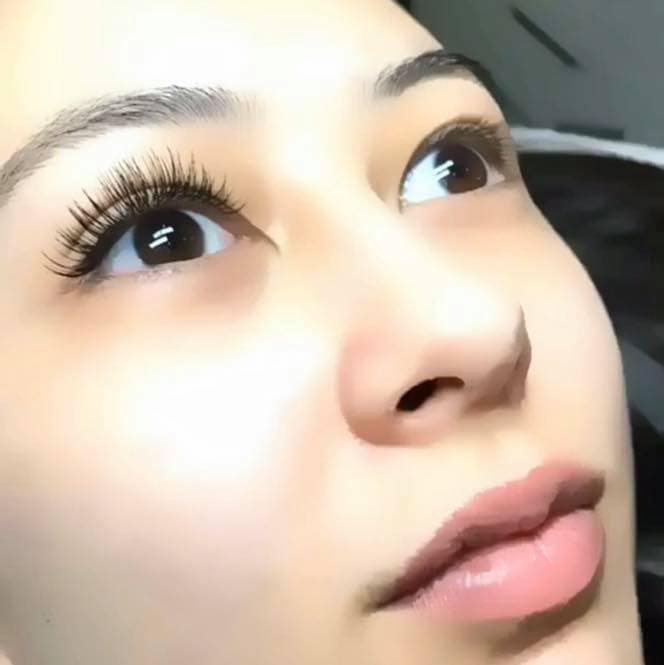 Natural classic lash result — client selfie