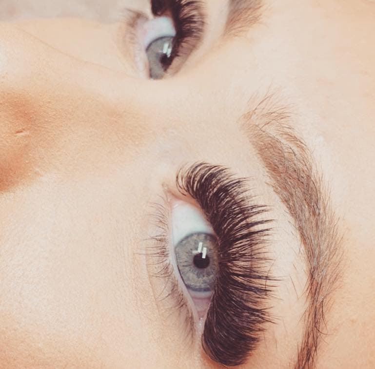 Volume lash extensions — blue eyes both lashes shown