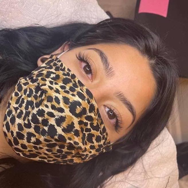 Natural lash result — client with leopard mask