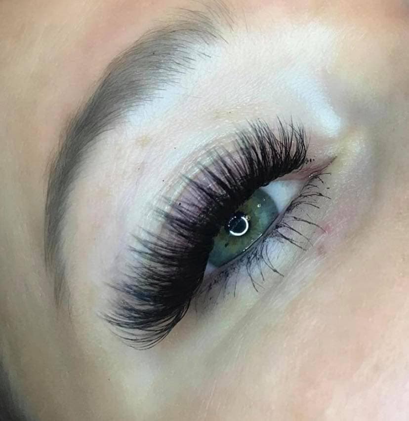 Volume lash extensions — green eye close-up